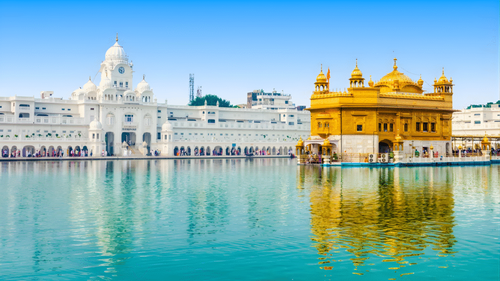 The Golden Temple framed by colonnades and its sacred pool, expressing symmetry and serene reflection.